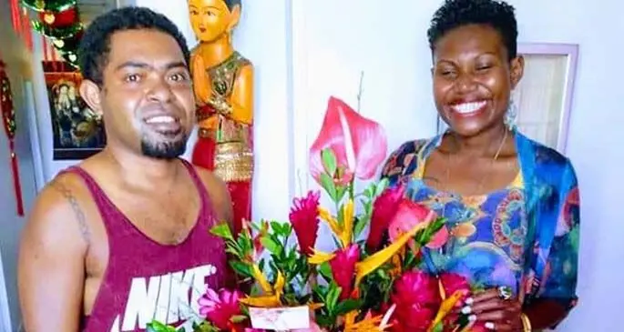 Maciu Natoga (left), with a happy customer in one of his arrangements.