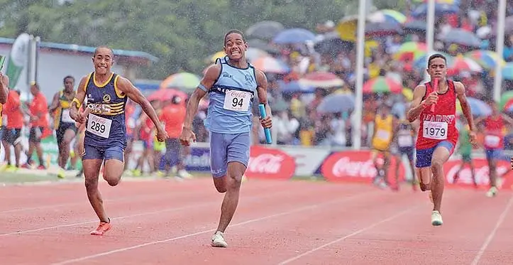 Marist Brothers High School’s Usaia Saumi (right) chases after Ratu Kadavulevu School and Queen Vctoria School during the junior boys 4x100 metres relay at the HFC Bank Stadium, Suva on April 29, 2023. Photo: Ronald Kumar