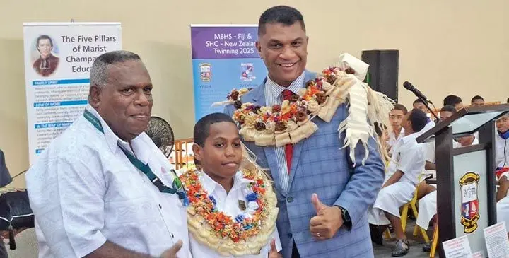 From left: Mitieli Uculoa (father), Michael Tugaga and Minister for Education Aseri Radrodro on July 21, 2025. Photo: Rariqi Turner