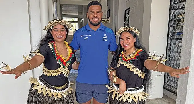 Fijian Drua flanker Motikiai Murray (centre) is flanked by Kiribati medical students Deirdre Fox (left) and Tekaboi Yeeting during the Fiji National University (FNU) open day, at Nasinu campus on October 5, 2024. Photo: Sereana Salalo