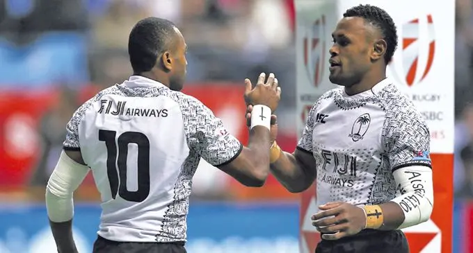 From left: Fiji Airways Fijian 7s winger Alasio Naduva is congratulated by Amenoni Nasilasila after scoring against Kenya in the Cup final on March 12, 2018. Photo: Zimbio