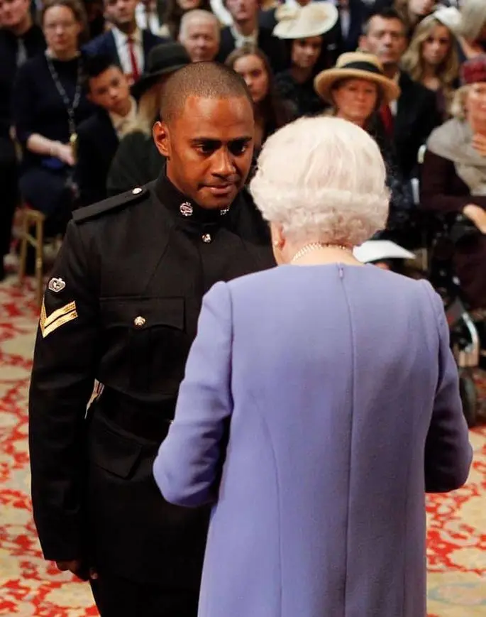 Fijian-born Corporal Saimone Qasenivalu of the British Armed Forces with Her Majesty Queen Elizabeth in London, England