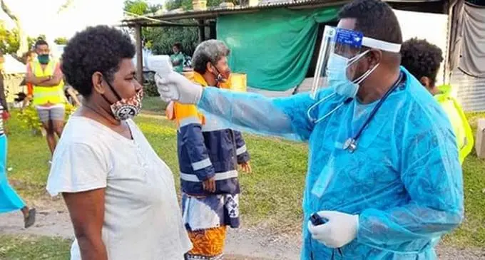 A healthworker screening a villager on Kadavu Island. Photo: Ministry of Health and Medical Services
