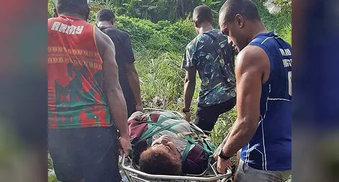 Firefighters rescue a woman to safety after she fell into a waterfall at the Vesi Crescent Creek in Lautoka last Thursday. Photo: National Fire Authority