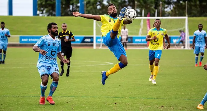 Nadroga striker Tomasi Tuicakau tries to control the ball in the air as Tailevu/Naitasiri defender Jone Naraba closes in on him during their Digicel Premier League clash at the ANZ Stadium, Suva, on March 20, 2022. Photo: Leon Lord.