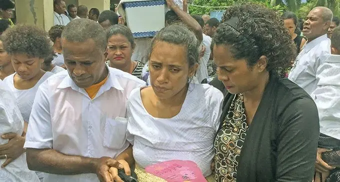 Jokapeci Canakaivata, wife of one of the deceased Lodoviko Canakaivata, is comforted at the funeral of her husband and the two others on January 2, 2021.  Photos: Inoke Rabonu