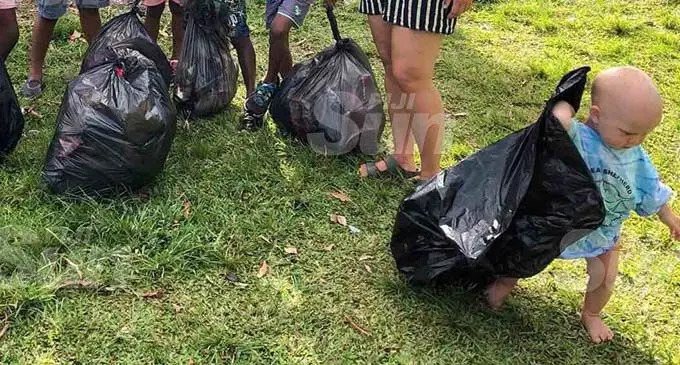 15-month-old baby Wilde da Silva Barrington (right) leads the team in picking uprubbish in Savusavu on December 21, 2019. Photo: Laisa Lui 