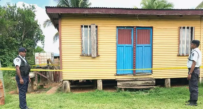 Police officers guarding the house where the alleged murder happened in Qeledamu Settlement, Labasa. Photo: Shratika Naidu