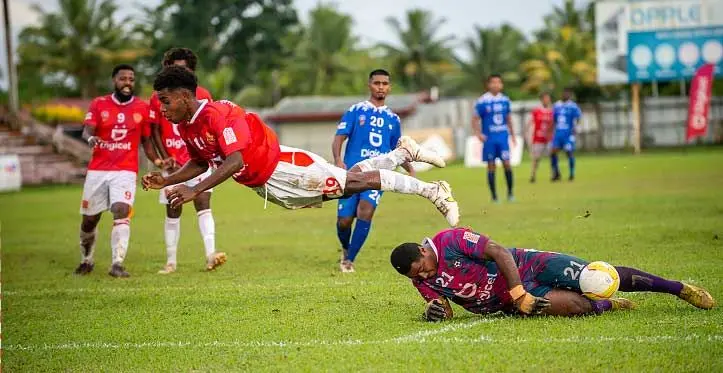 Rewa’s Asivorosi Rabo dives over Lautoka goalkeeper Joela Biuvanua who made a save during their Digicel Fiji Premier League match at Ratu Cakobau Park, Nausori, on April 16, 2023. Rewa won 4-1. Photo: Leon Lord
