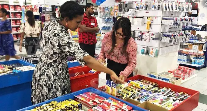 Post Fiji Pte Limited staff members getting the stock organised inside the new eShop in Suva on December 13, 2019. Photo: Jennis Naidu