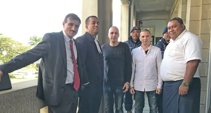Lawyer Filimoni Vosarogo with clients Loizos Petridis and Cleanthis Petridis outside the High Court in Suva on September 04, 2019.