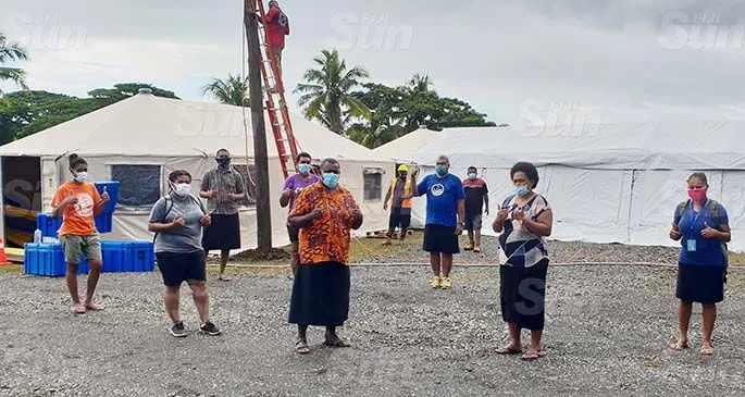 The Acting Superintendent at the Colonial War Memorial (CWM) Hospital, Dr Luke Nasedra (third from front-left) and Nursing team leader, Sister Maria Vucago with some of the nurses and doctors that looked after patients who were kept at the Fiji Emergency Medical Assistance Team (FEMAT) Lautoka. Photo: Nicolette Chambers