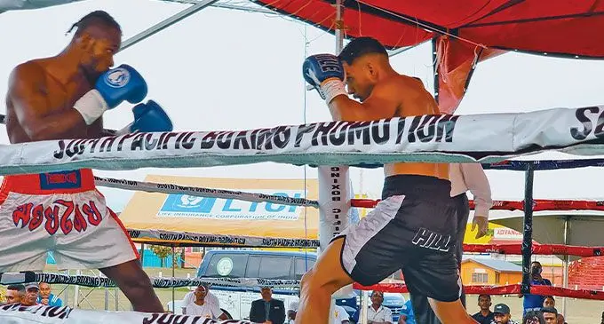 From left: Vanuatu boxer Roy Ser shapes up against Winston Hill in their 10-round fight at Subrail Park, Labasa, on August 10, 2024. Hill won on a third round knockout. Photo: Sampras Anand