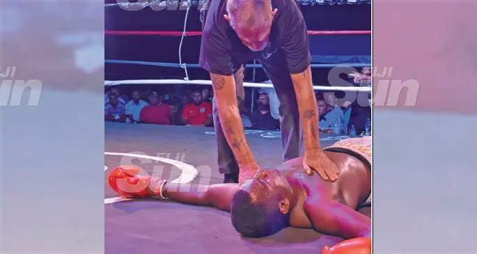 Referee Allen Harris attends to heavyweight boxer Jonasa Kavika after he was knocked out by James Singh in Nadi on November 30, 2019. Photo: Waisea Nasokia