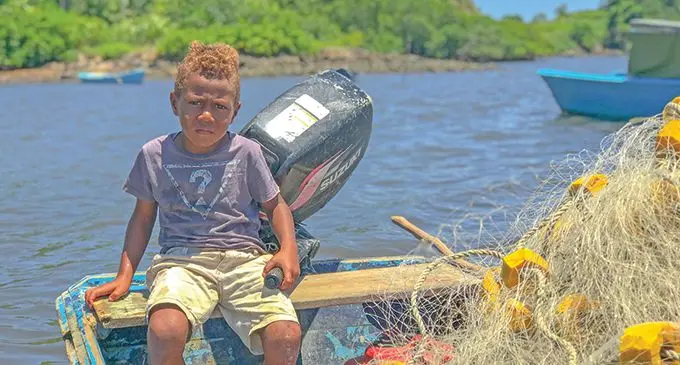 Four-year-old, Sakeasi Rabaka sits in the boat that he, his late grandfather, Josese Naululoa and his eight-year-old cousin Josese used to go fishing.  Photo: Kelera Sovasiga