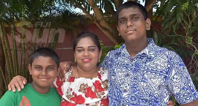Praveena Lata with her two son, (left) Darshneel Dev Kumar and (right) Niklesh Kumar at Nadi Town. Photo: Mereleki Nai