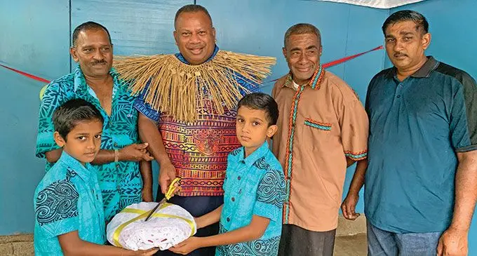 Minister for Defence, National Security and Policing, Rural and Maritime Development and Disaster Management Inia Seruiratu with Vunivau Bakery owner Hirdesh Gupt (second from left) and community members in Bua on March 16, 2022.