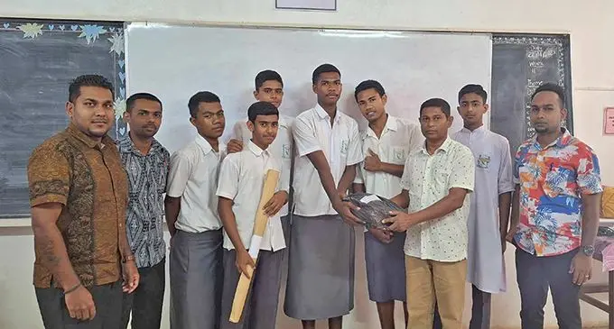 Labasa Muslim College Principal Shanil Dutt (front) handed over awards to students including the dropouts while being accompanied by the teachers including Atul Sharma (second from the left standing beside Dhiren Singh) and Krishneel Chand (right) in Labasa on November 22, 2023.