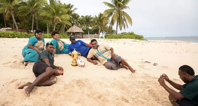  The Tavarua Island Resort staff pose with the Webb Ellis Cup at Tavarua Island.