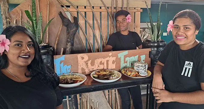 From left: Shayal Chand, Louis Turagadua and Milly Seni with few menus on display.  Photo: Waisea Nasokia
