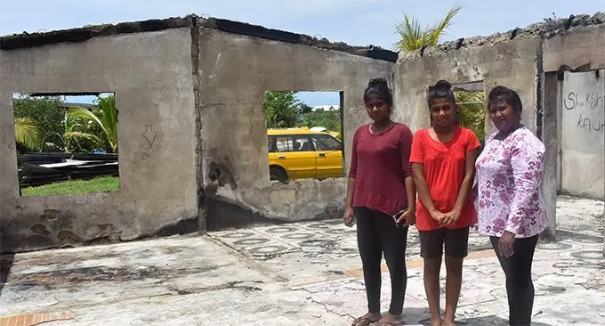 From left Sandika Kaur, Shakshi and their mother Babita Devi inside what's left of their home in Olosara, Sigatoka on March 7, 2019. Photo: Nicolette Chambers