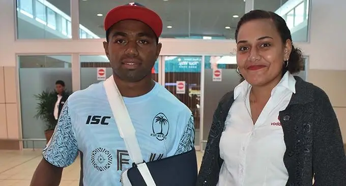 Fiji Airways 7s playmaker Waisea Nacuqu with a fan Elizabeth Ravula at the Nadi International Airport on March 6, 2019.  Photo: Waisea Nasokia