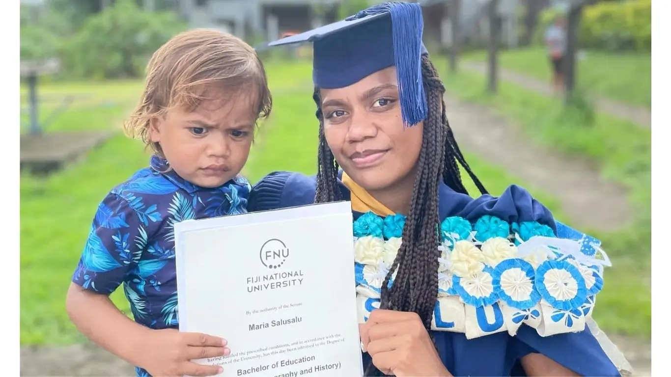 Maria Salusalu with her son Joshua Vereyali at her graduation.