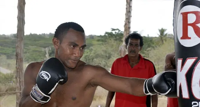 Siliveni Nawai works on the punching bag as trainer Chunchul Baba Kumar looks on in Mulomulo, Nadi. Photo: Waisea Nasokia