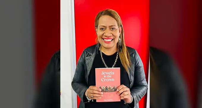 Jewels in the Crown author Sala Tuinabua with her book