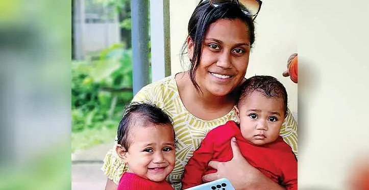 Australia Pacific Training Coalition (APTC) graduate Ranadi Matairavula Dakai with her daughters Vilimana Vuya Raliwa (left) and Vika Lewanitokalau on September 11, 2023.