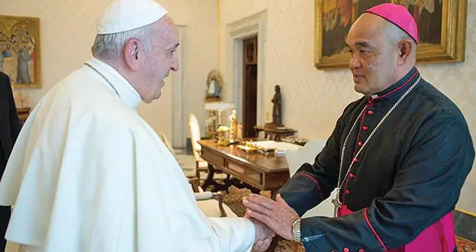 Archbishop of the Catholic Church in Fiji Peter Loy Chong (right), with Pope Francis at the Vatican.