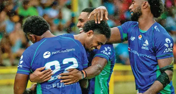 Swire Shipping Fijian Drua centre Iosefo Masi is congratulated by teammates after scoring a try against the Melbourne Rebels during their pre-season trial match at Prince Charles Park, Nadi on January 28, 2023. Photo: Pita Simpson 