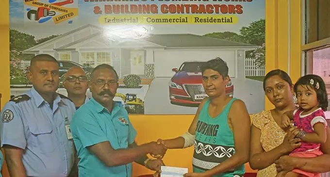 From left: National Fire Authority station officer Nadi Mohammed Imran, Amit Singh and Wananavu Group of Companies managing director Vijay Parmanandam with Nilesh Rai, Rital Prasad and Namaya Rai in Nadi on March 11, 2021.   Photo: Waisea Nasokia