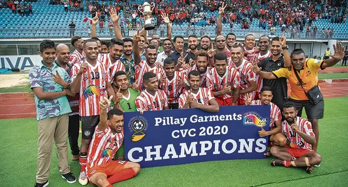 The Powerwise Electrical (NZ)/Standard Hire Labasa football team, with officials and fans celebrate their Pillay Garments Champions versus Champions title win over Unique Rubber Stamp Suva on February 21, 2021. They beat Suva 2-1 at Suva’s ANZ Stadium to retain the title.  Photo: Leon Lord