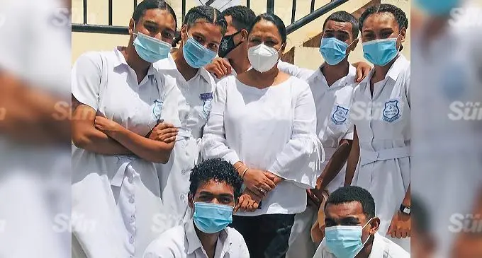 Minister for Education Premila Kumar with students of Khalsa College in Labasa after her short visit and handed over sanitiser and masks on December 17, 2021. Photo: LAISA LUI