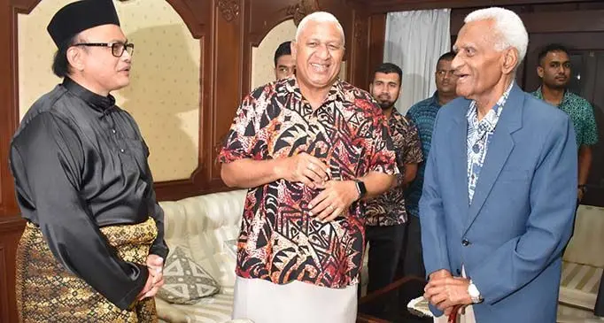 From left: High Commissioner of Malaysia Ilham Tuah Illias, Prime Minister Voreqe Bainimarama and former politician, business executive and retired military officer Manu Korovulavula on Malaysia’s 63rd Independence Day and 57th Malaysia Day celebration at the Malaysia House in Tamavua. Mr Korovulavula was amongst Fijian soldiers who helped fight Communist insurgents in the Malayan jungles in the 1950s. Photo: DEPTFO News