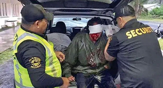 Charles Leger being helped by private security personnel after his bike was hit by an unknown vehicle.  