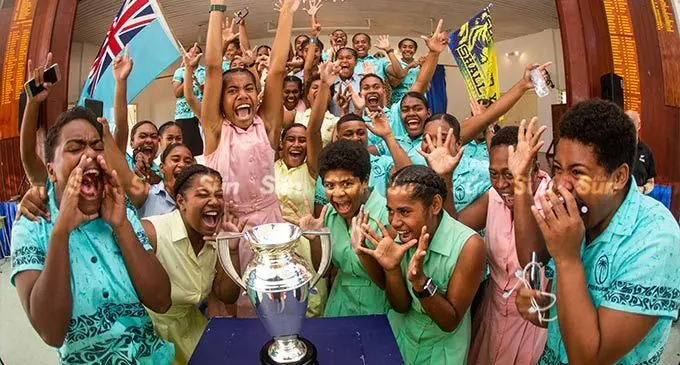 Suva Grammar School supporters and student pose beside the Women’s Rugby World Cup at the school on September  13, 2022. The Women’s World Cup will be staged in New Zealand, next month. Photo: Leon Lord