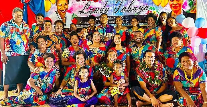 Minister for Women, Children and poverty Alleviation Lynda Tabuya (seated third from left wearing garland), with her husband Robert Semaan (also with garland) and villagers of Tiliva in Kadavu.