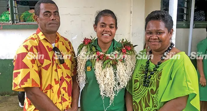 Iowana Seveikau with her parents after she was awarded the leadership badge at the Ballantine Memorial School on May 6, 2022.  Photo: Josefa Babitu 