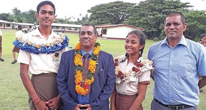 From Left: South Taveuni Secondary School headboy Shivneet Narayan, Assistant Minister for Education Joseph Nand, headgirl Sheenal Reddy and principal Dharam Singh during the prefect induction on February 8,2019. Photo:Supplied
