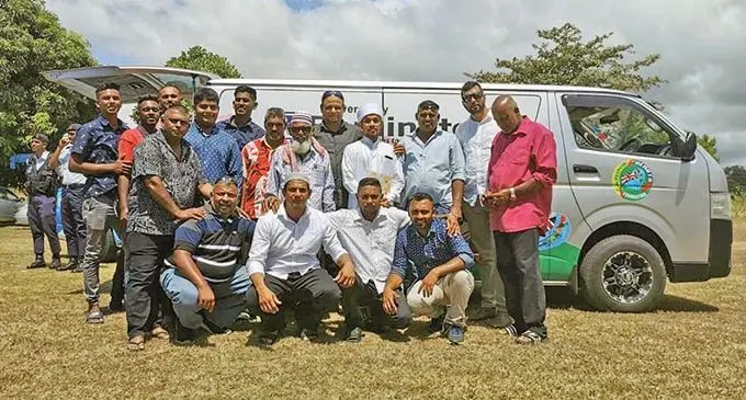 Members of the Caring Hearts Foundation Fiji with the funeral van. Photo: Waisea Nasokia