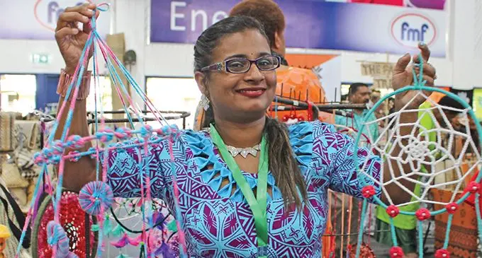 Stay-at-home mum and entrepreneur Amrita Nand holds wall-hangings she crocheted to sell at the 2019 Fiji National Women’s Expo on June 12, 2019. Photo: Sydnee Gonzalez