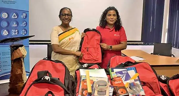 Ministry of Education, Heritage and Arts Permanent Secretary Anjeela Jokhan (left) with Save the Children Fiji chief executive officer Shairana Ali with school bag kits for the Ministry of Education.  Photo: Save the Children Fiji 