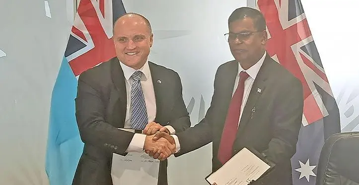 Australian High Commission Charge D’affaires John Williams and Minister for Finance Biman Prasad after the signing on March 21, 2023. Photo: Jone Salusalu