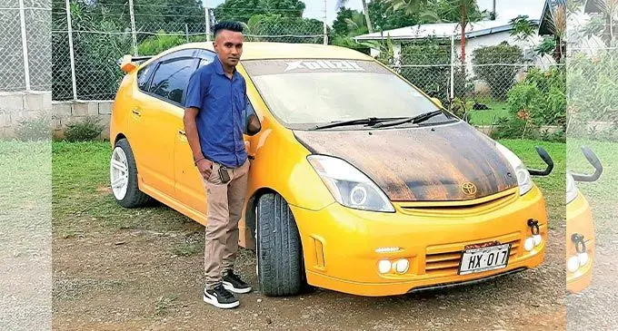 Shalveen Kumar outside his home in Nepani with his Hybrid 1.5 car.