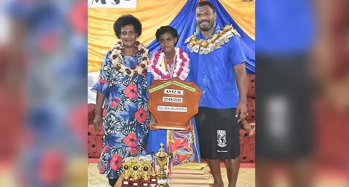 From left: Siteri Keci (Siliva’s mother), Ratu Nemani Memorial School dux Siliva Burotu and chief guest Fiji Bati and Parramatta Eels rugby league winger Maika Sivo during the school’s graduation at Momi Village, Nadroga. Photo: Waisea Nasokia