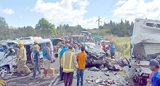 Fire officers at the scene where the three-vechicle smash up took place at Nabou in Nadroga yesteday. Photo: WAISEA NASOKIA