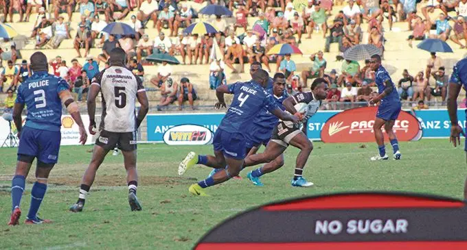 Barbarian Brothers team captain, Seremaia Tuwai, breaks away from the Police attackers during 3rd and 4th Playoffs Marist 7s tournament at the Vodafone ANZ Stadium.   Photo: Kelera Sovasiga