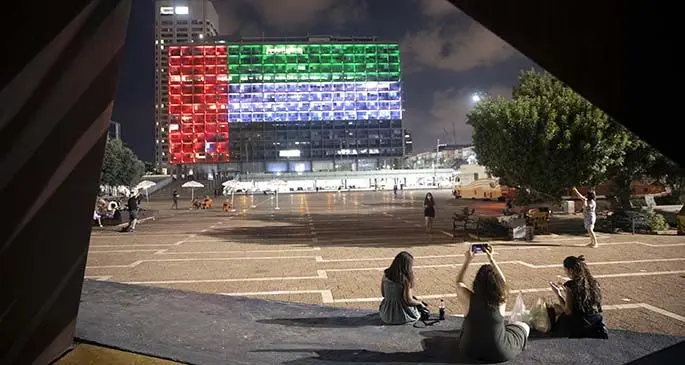 The city hall building in Tel Aviv, Israel lit up in the colours of the United Arab Emirates’ national flag.